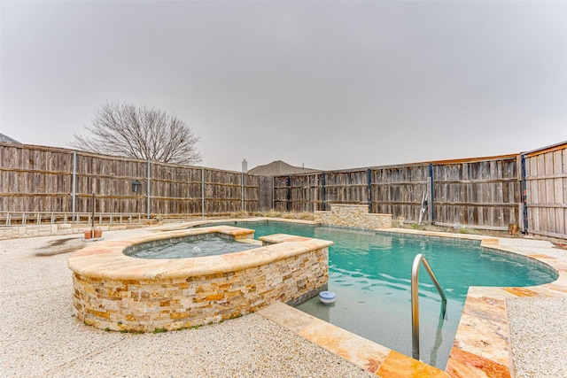 view of swimming pool featuring an in ground hot tub