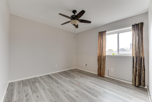 unfurnished room featuring ceiling fan and light wood-type flooring