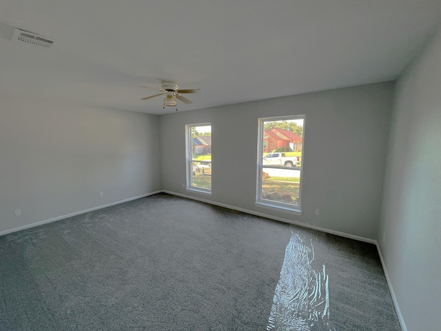 empty room featuring carpet and ceiling fan