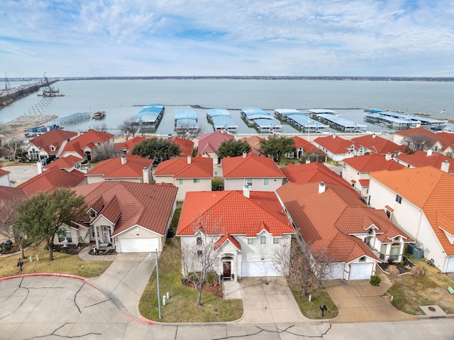 birds eye view of property featuring a residential view and a water view