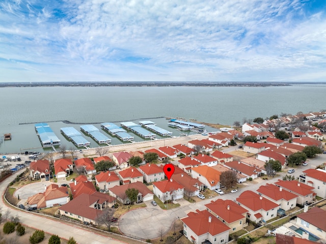 bird's eye view featuring a residential view and a water view