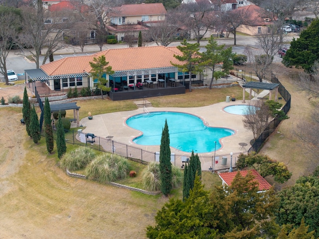 view of swimming pool with a patio and a yard