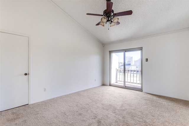 spare room featuring ceiling fan, lofted ceiling, light colored carpet, and a textured ceiling