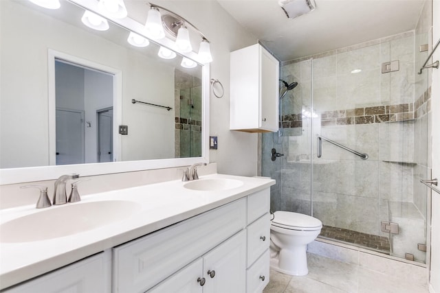 bathroom featuring walk in shower, tile patterned floors, vanity, and toilet