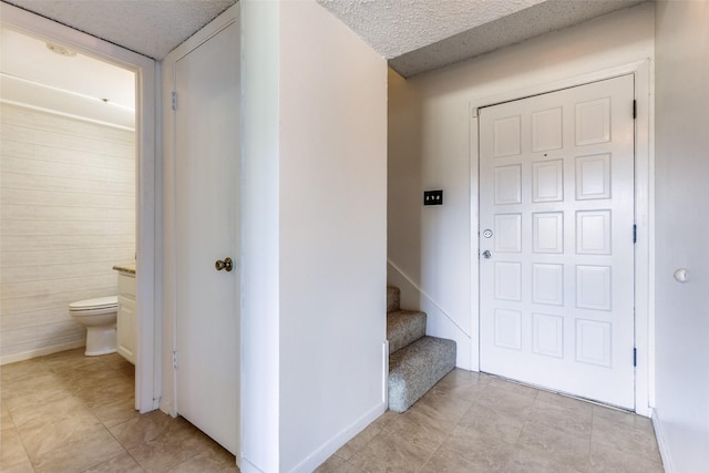 interior space featuring a textured ceiling