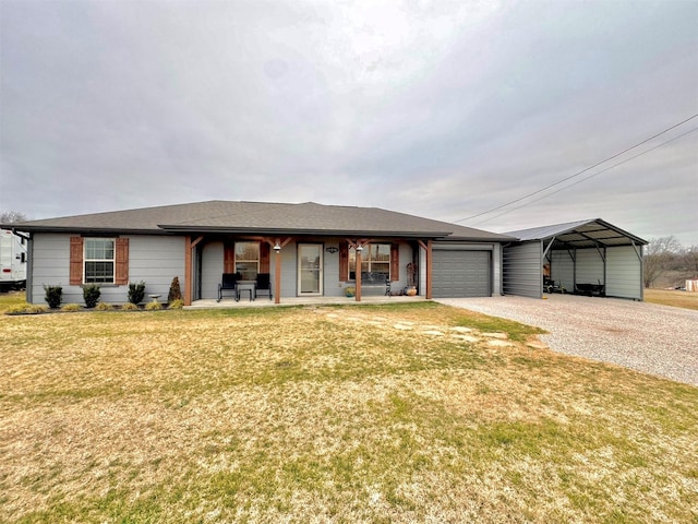 single story home featuring a carport, a garage, and a front lawn