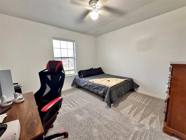 bedroom with light carpet and ceiling fan