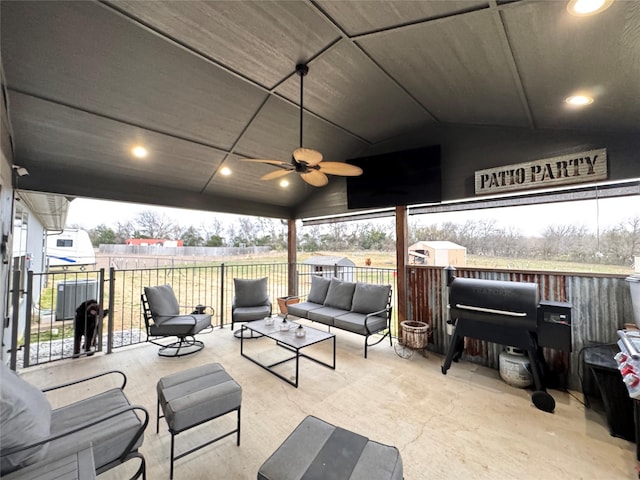 view of patio with ceiling fan and an outdoor living space