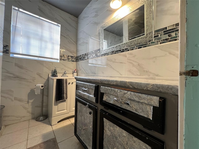 kitchen with tile walls and light tile patterned floors