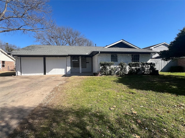 ranch-style home featuring a garage and a front yard