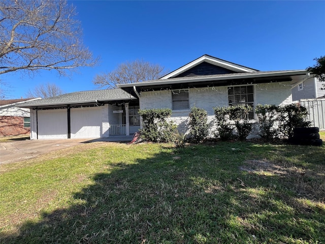 view of front of home with a garage and a front yard