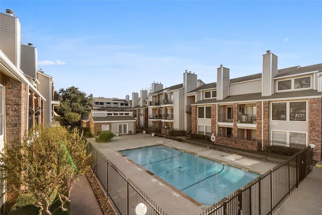 view of swimming pool featuring a patio area