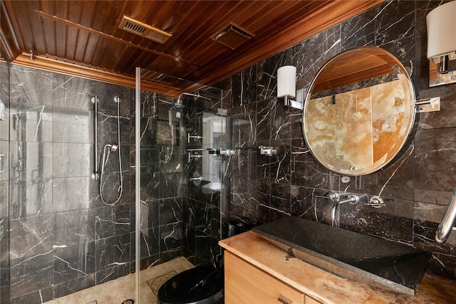 bathroom featuring wood ceiling, tile walls, vanity, ornamental molding, and walk in shower