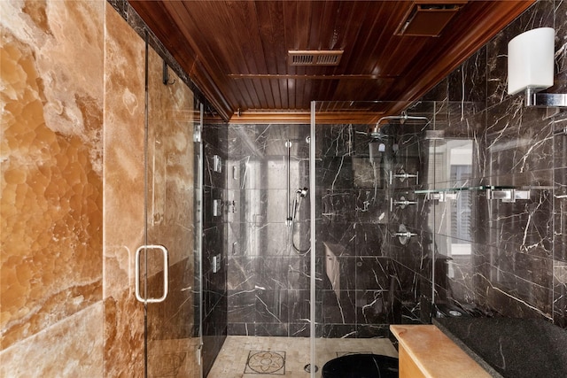 bathroom with a shower with door and wooden ceiling