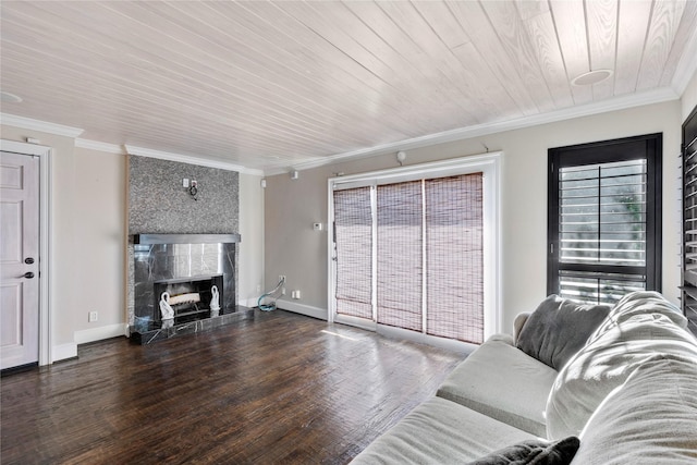 living room featuring wood ceiling, dark wood-type flooring, a fireplace, and ornamental molding