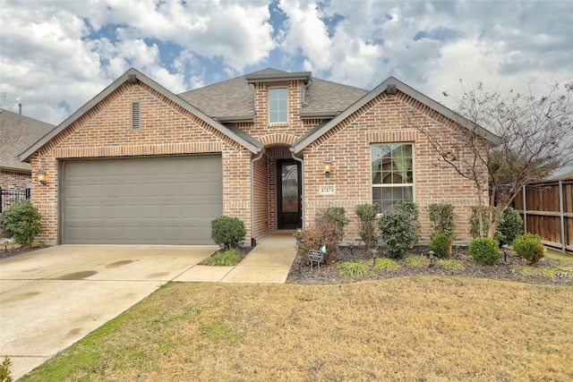 view of front property with a garage and a front yard