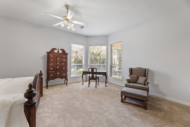 sitting room featuring light carpet and ceiling fan