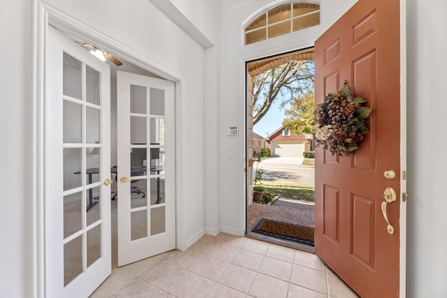 entryway featuring french doors and light tile patterned floors