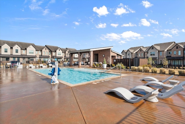 view of swimming pool with a patio