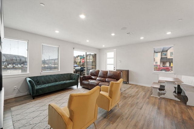 living room with light hardwood / wood-style floors