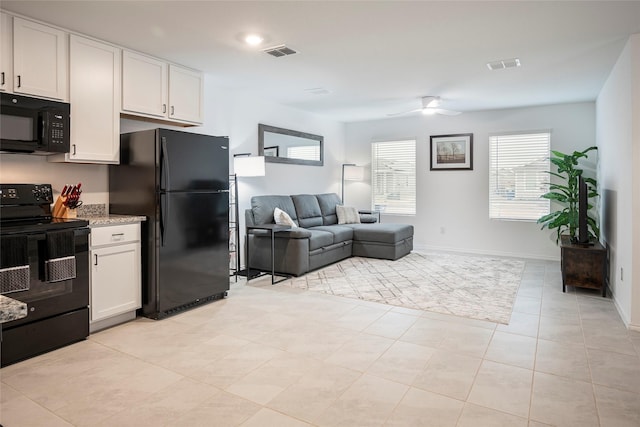 kitchen featuring ceiling fan, white cabinets, light tile patterned flooring, and black appliances