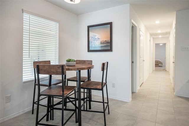 dining area featuring light tile patterned floors