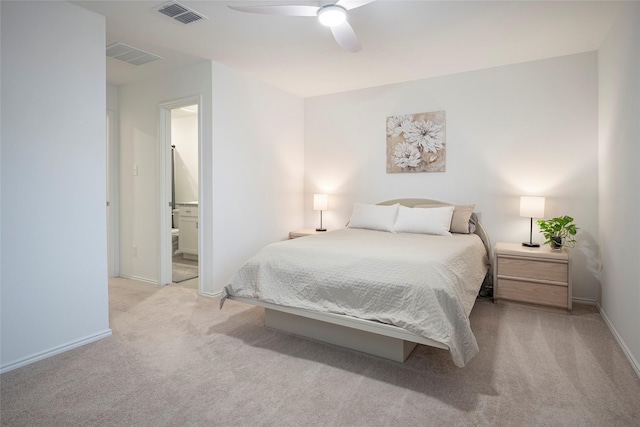 carpeted bedroom featuring connected bathroom and ceiling fan