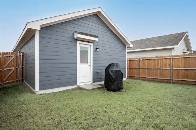 rear view of property with a lawn