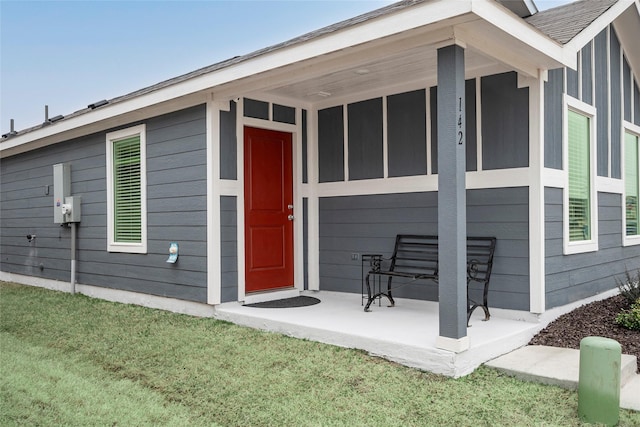 entrance to property with a yard