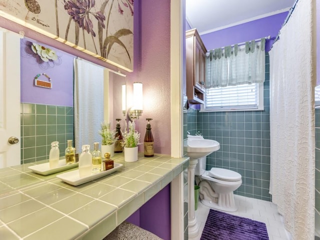 bathroom featuring tile patterned flooring and toilet