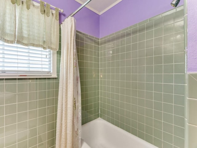 bathroom with crown molding and shower / bath combo