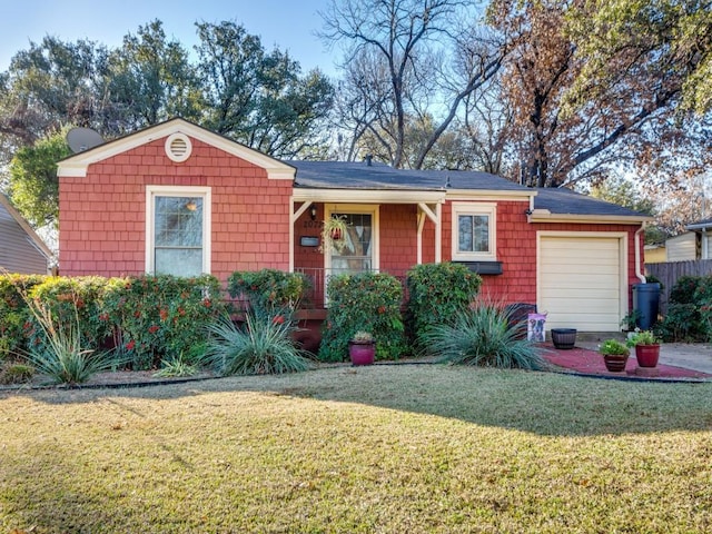 ranch-style home featuring a garage and a front yard