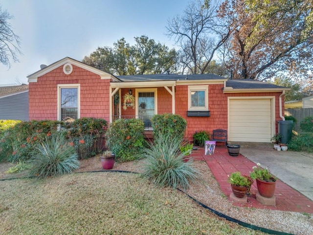 ranch-style home featuring a garage