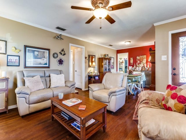 living room featuring crown molding, dark wood-type flooring, and ceiling fan