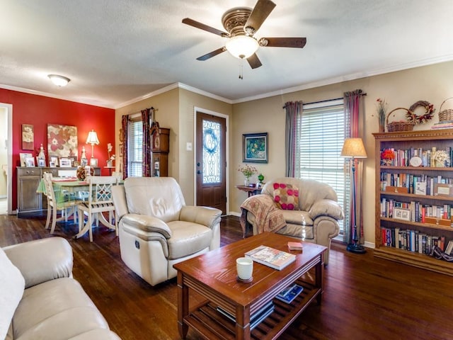 living room with crown molding, ceiling fan, and dark hardwood / wood-style flooring