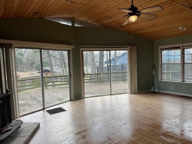 interior space featuring ceiling fan, lofted ceiling, and wooden ceiling