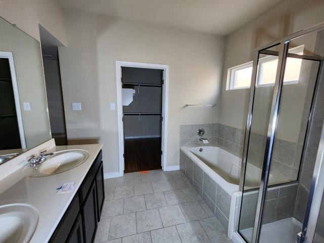 bathroom featuring vanity, separate shower and tub, and tile patterned flooring