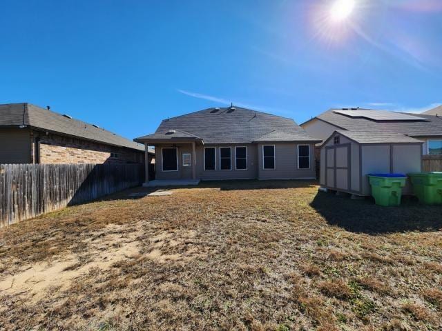 rear view of house with a shed