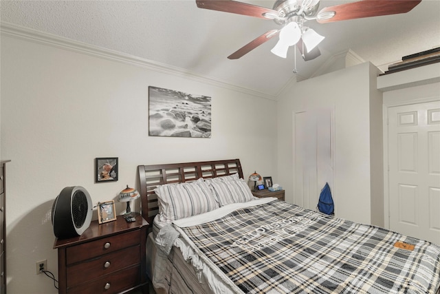 bedroom with ceiling fan, ornamental molding, and vaulted ceiling