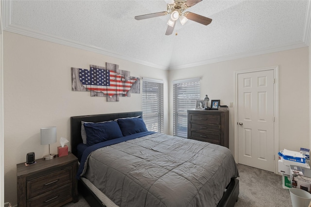 carpeted bedroom with lofted ceiling, ceiling fan, crown molding, and a textured ceiling