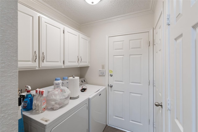 washroom with cabinets, ornamental molding, washer and clothes dryer, and a textured ceiling