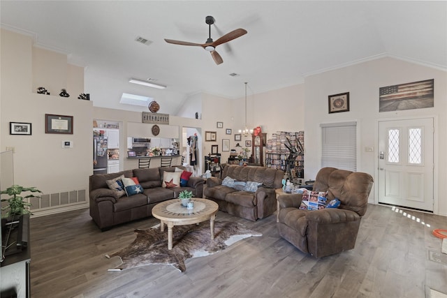 living room featuring ceiling fan, ornamental molding, high vaulted ceiling, and wood-type flooring