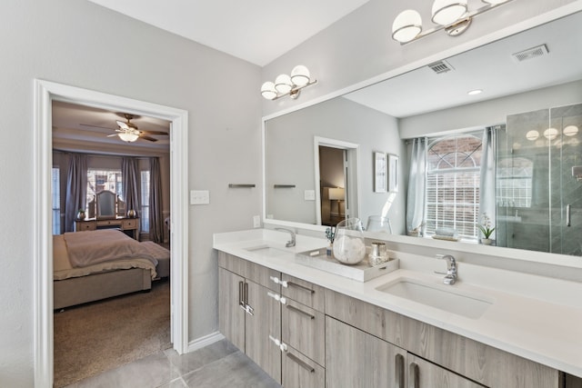 bathroom with vanity, plenty of natural light, and tile patterned floors