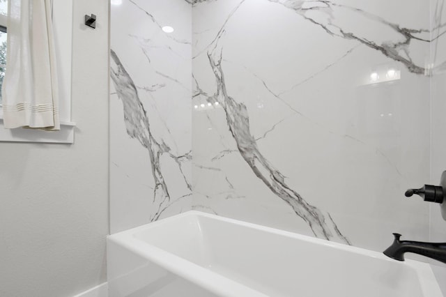 bathroom featuring bathing tub / shower combination