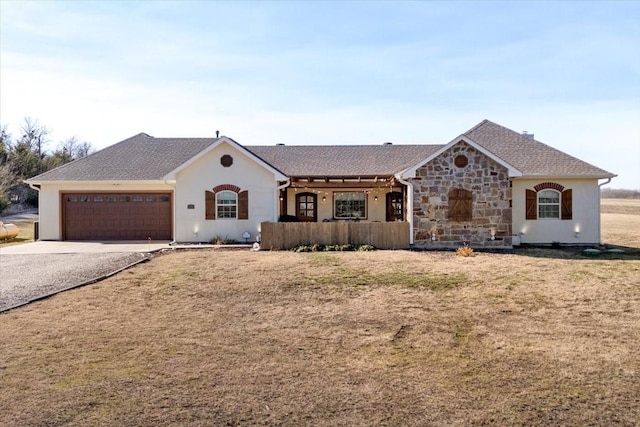 single story home with a garage and a front yard