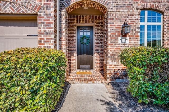 property entrance with brick siding