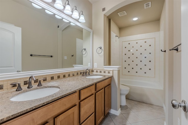 full bathroom featuring tile patterned flooring, backsplash, vanity, shower / bathing tub combination, and toilet