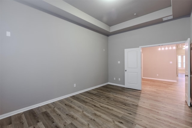 spare room with hardwood / wood-style floors