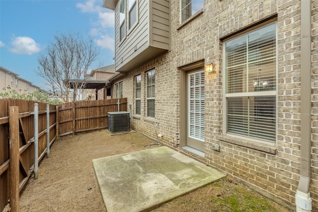 view of yard with a patio and central AC unit