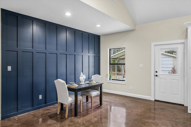 dining area featuring vaulted ceiling